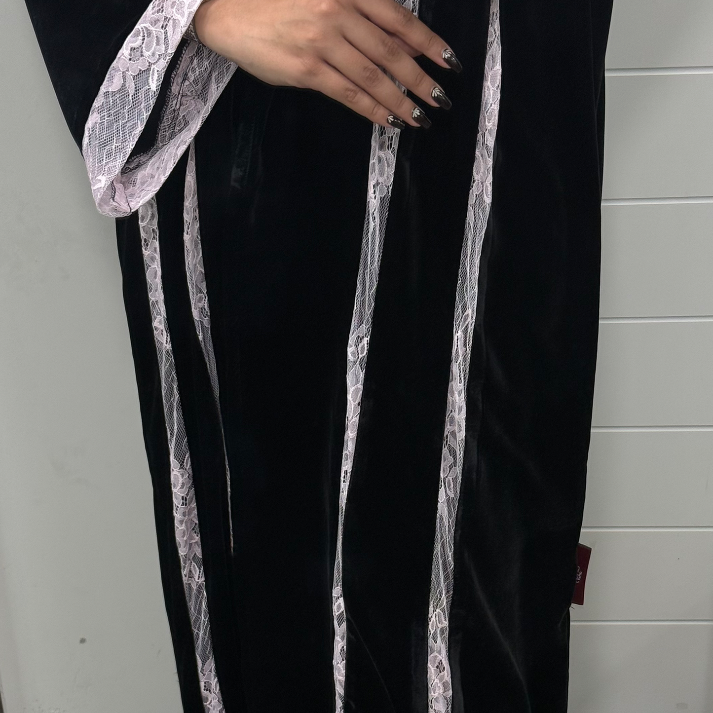A black abaya with velvet fabric and baby pink dantel