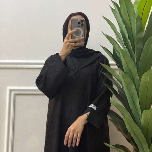 Formal abaya with printed fabric.