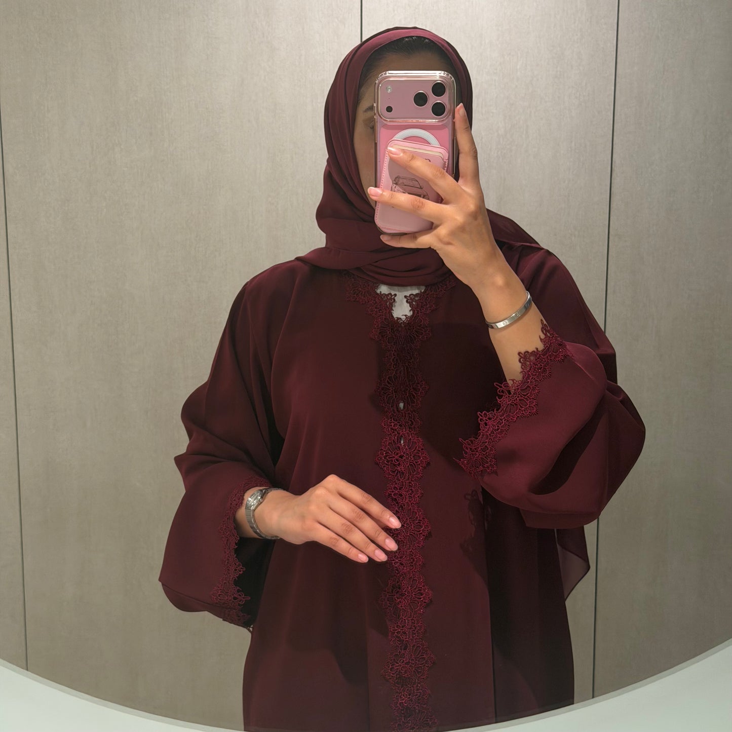 A dantel abaya with maroon fabric