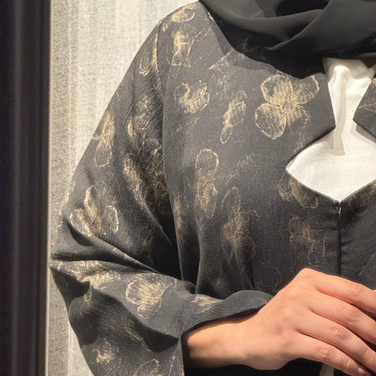 Abaya with black color and gold flowers