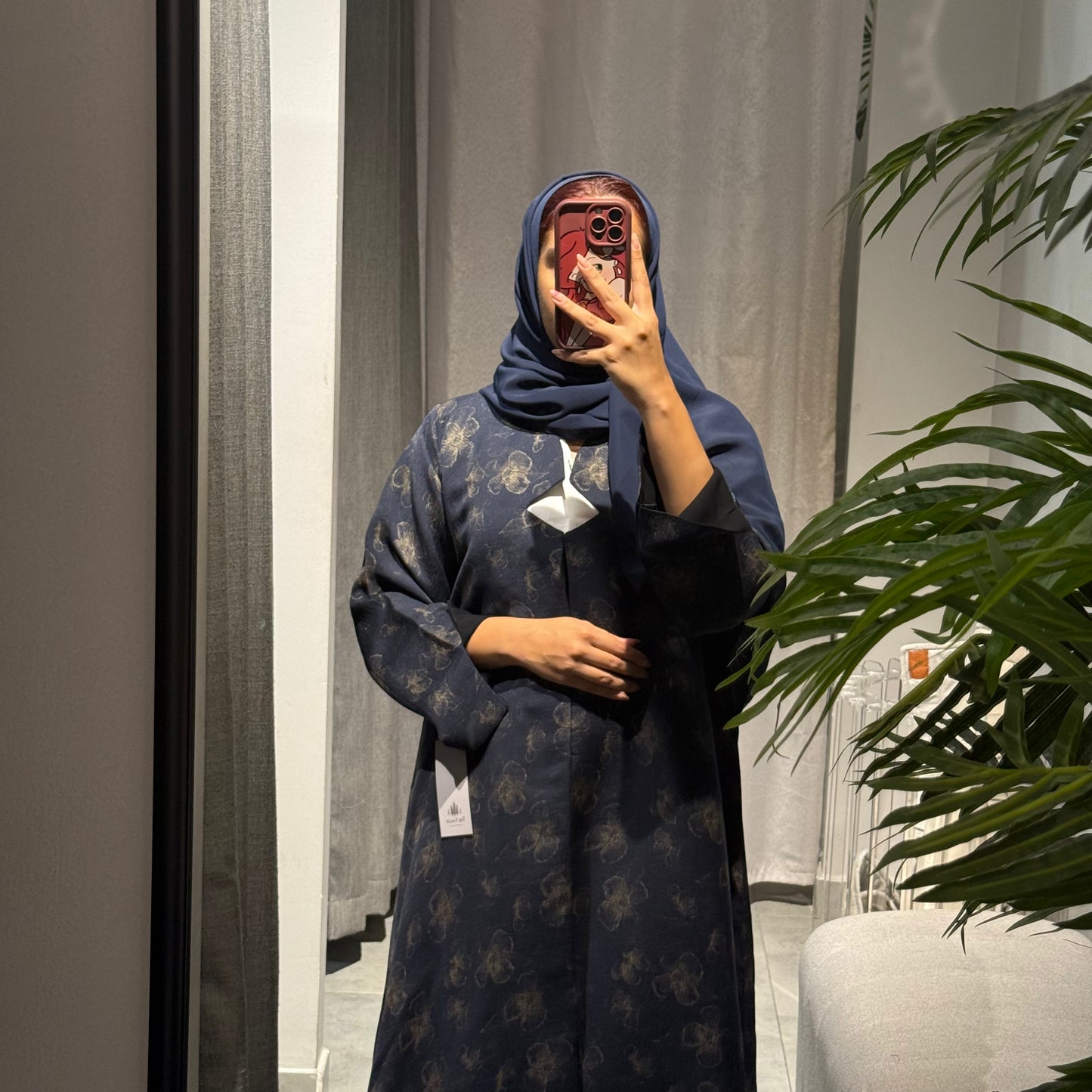 Abaya with blue color and gold flowers
