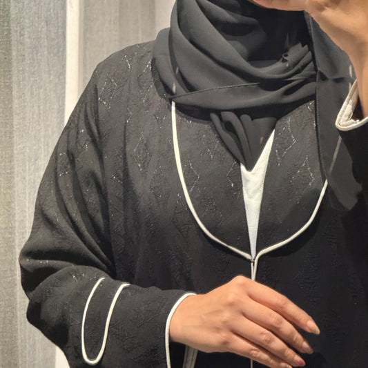 A black printed formal Abaya with white lines