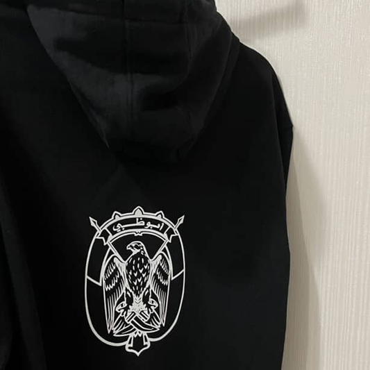 A black hoodie made for Emirati with Abu Dhabi logo