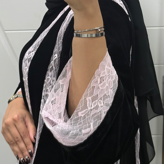 A black abaya with velvet fabric and baby pink dantel